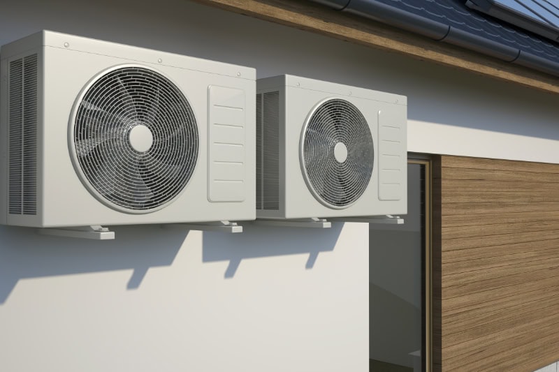 outdoor air conditioners attached to a building.