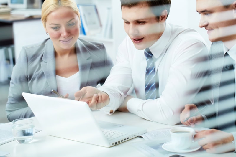 What Indoor Air Quality Accessories Can Help Keep Me Healthy? Photo of a group of business people work in an office together.